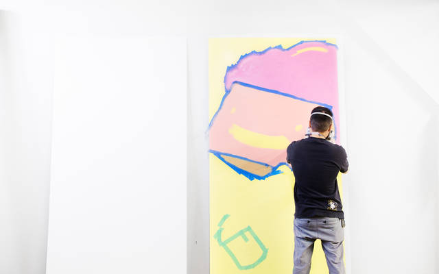 Vancouver based illustrator Carson Ting at work in his studio
