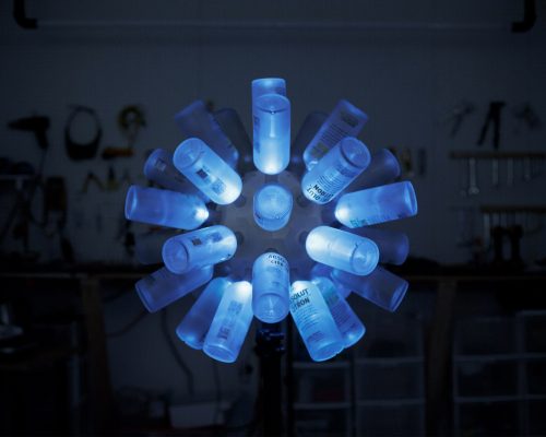 Interactive LED sculpture built from Absolut vodka bottles by Tangible interaction