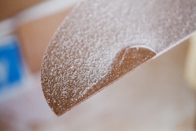 Surfboard form covered in foam with shallow depth of field